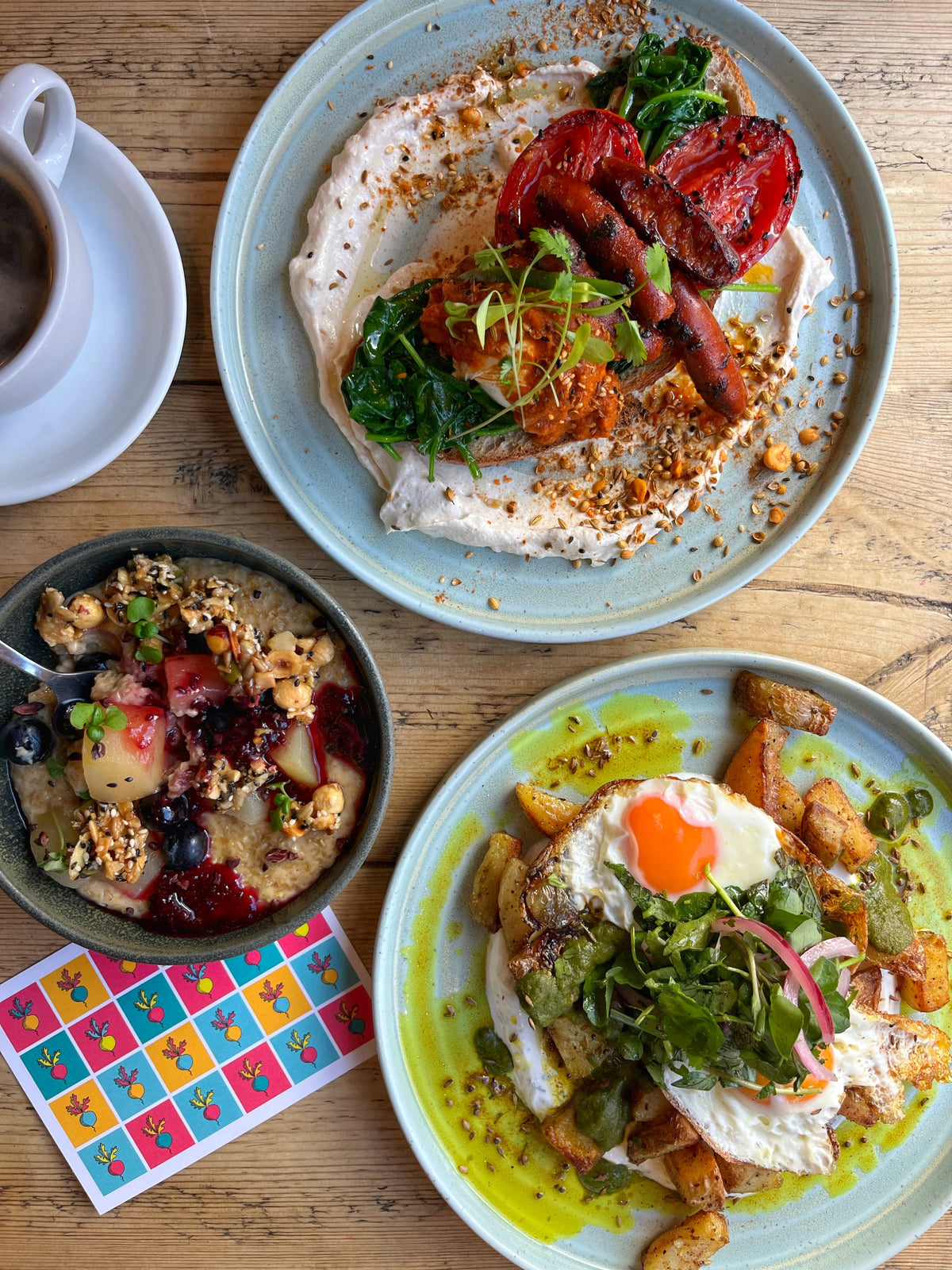 An image showing some of our popular brunch dishes: chorizo brunch, masala potatoes and porridge.