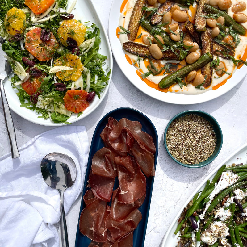 Example catering dishes: green bean salad with green lentils, yoghurt and za'atar, ajo blanco, butter beans and courgettes & citrus, cumin and olive salad.