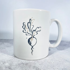 Salt the Radish mug with black and faun radish logo.