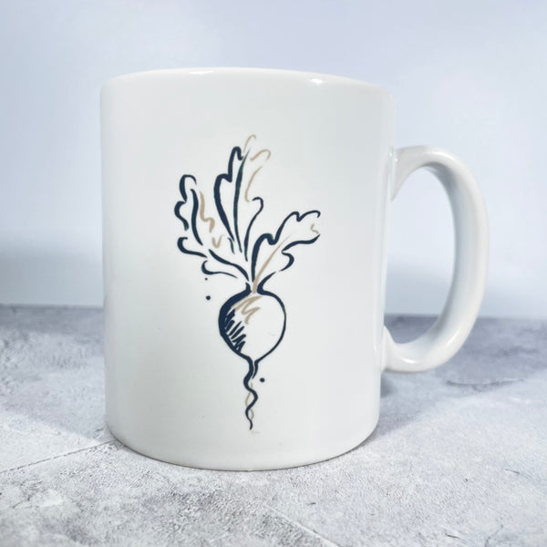 Salt the Radish mug with black and faun radish logo.