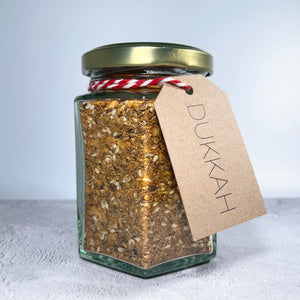 A jar of our house dukkah with label.