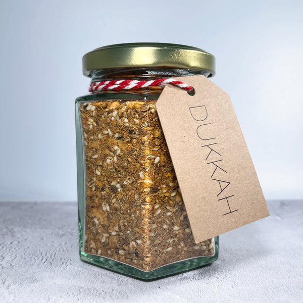 A jar of our house dukkah with label.